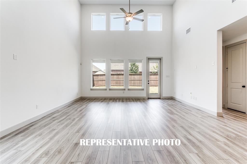 With floor to ceiling windows, this home is flooded with natural light both upstairs and down! REPRESENTATIVE PHOTO With floor to ceiling windows, this home is flooded with natural light both upstairs and down! REPRESENTATIVE PHOTO