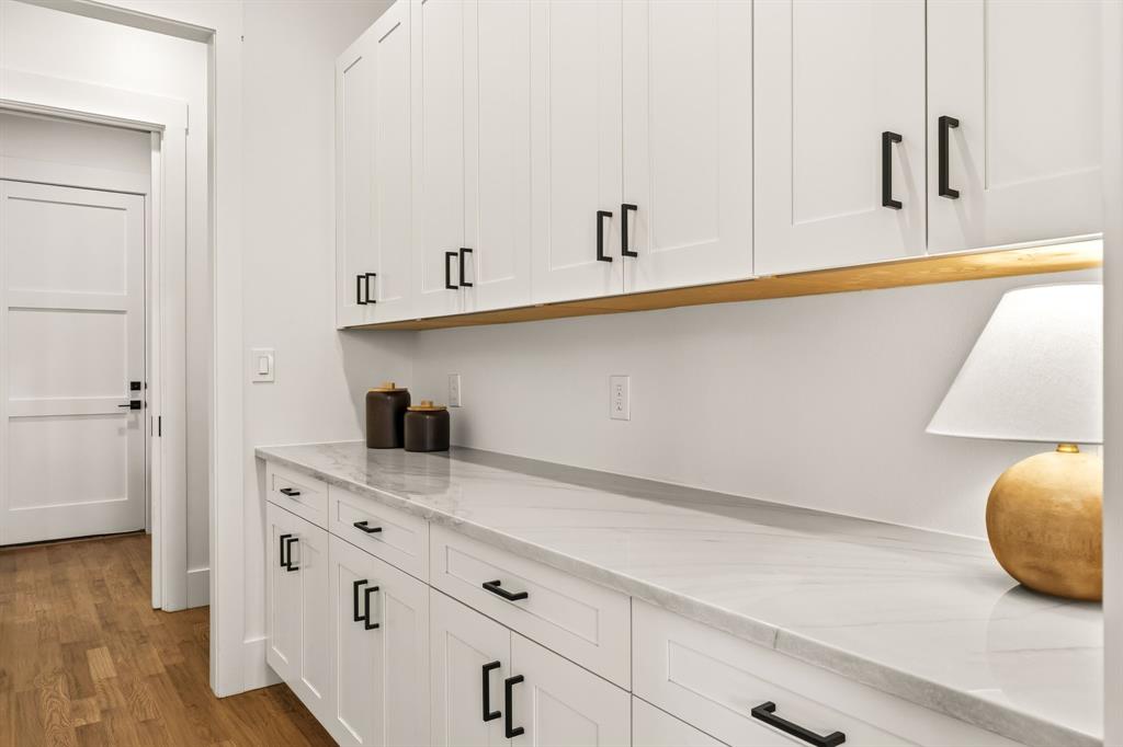 Butler's pantry directly behind kitchen provides excellent storage and saves counter space