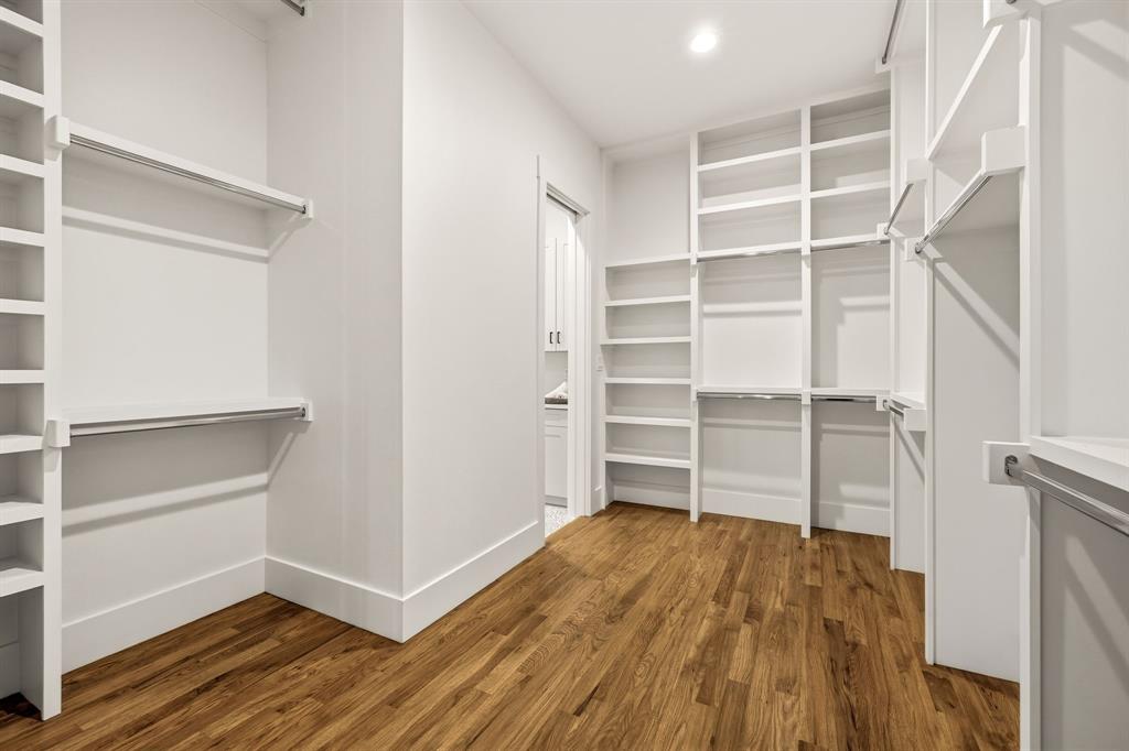 Primary bedroom's closet - direct access to laundry room