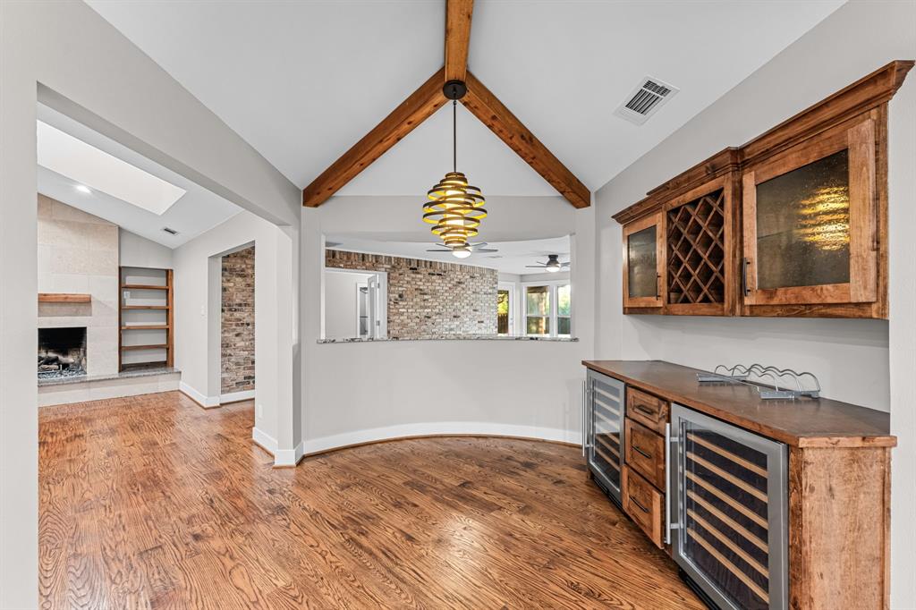 Breakfast room includes a dry bar area with 2 wine fridges.