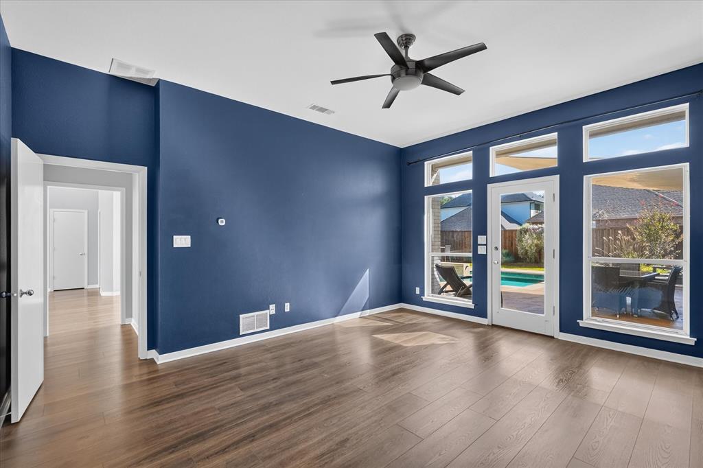 Primary bedroom downstairs with patio access.