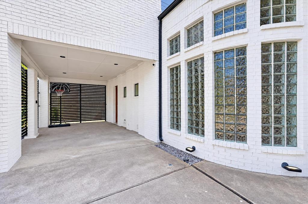 One car covered parking off the circular drive in front. Door access to kitchen.