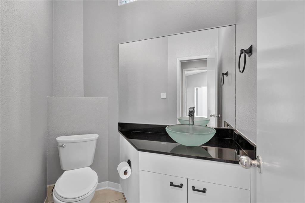Half bath off den and kitchen.
