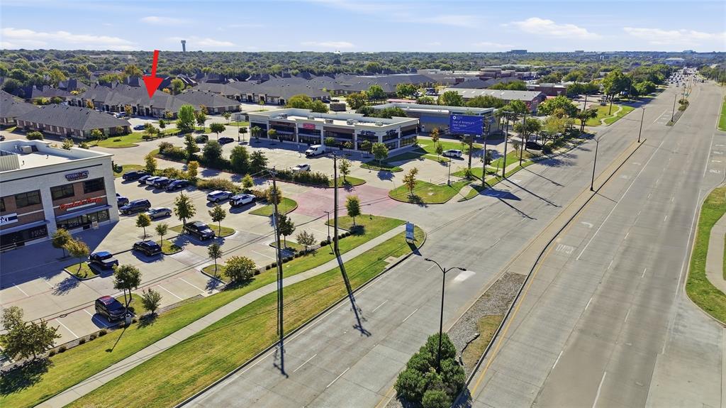 Aerial perspective of the property featuring proximity to major thoroughfares, multi-unit commercial zoning, paved parking infrastructure, and landscaped peripheral greenspace Aerial perspective of the property featuring proximity to major thoroughfares, multi-unit commercial zoning, paved parking infrastructure, and landscaped peripheral greenspace