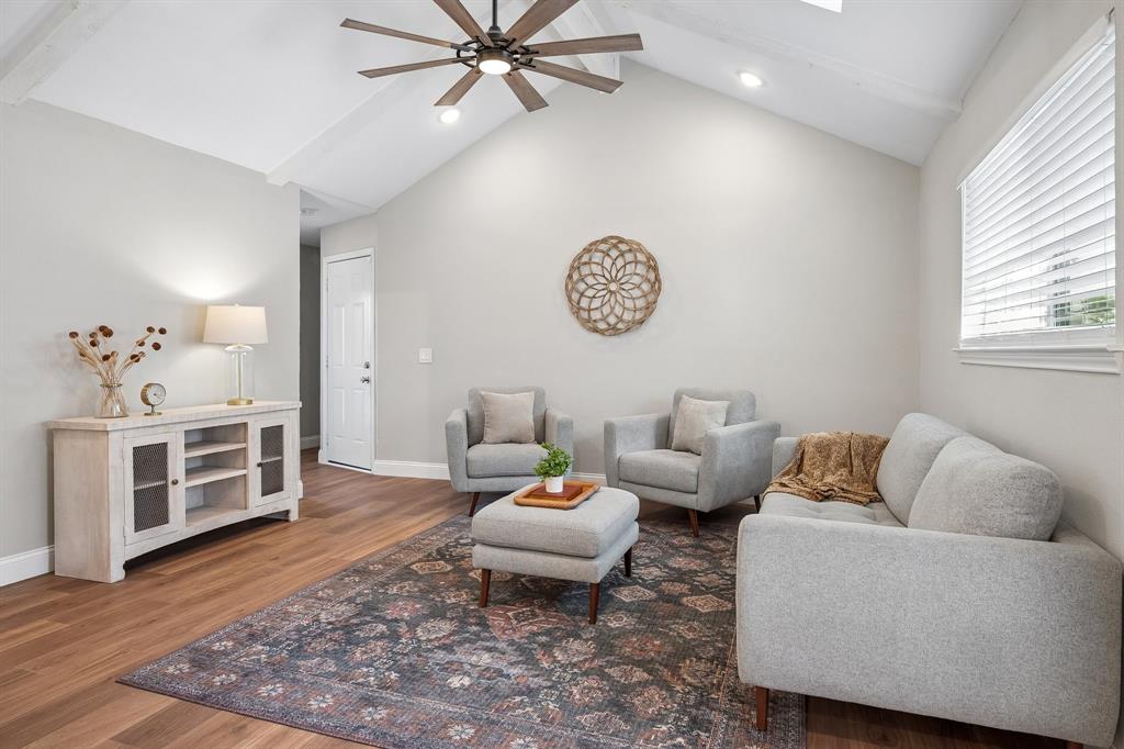 Comfortable and bright, this second living area provides a scenic view to the backyard.