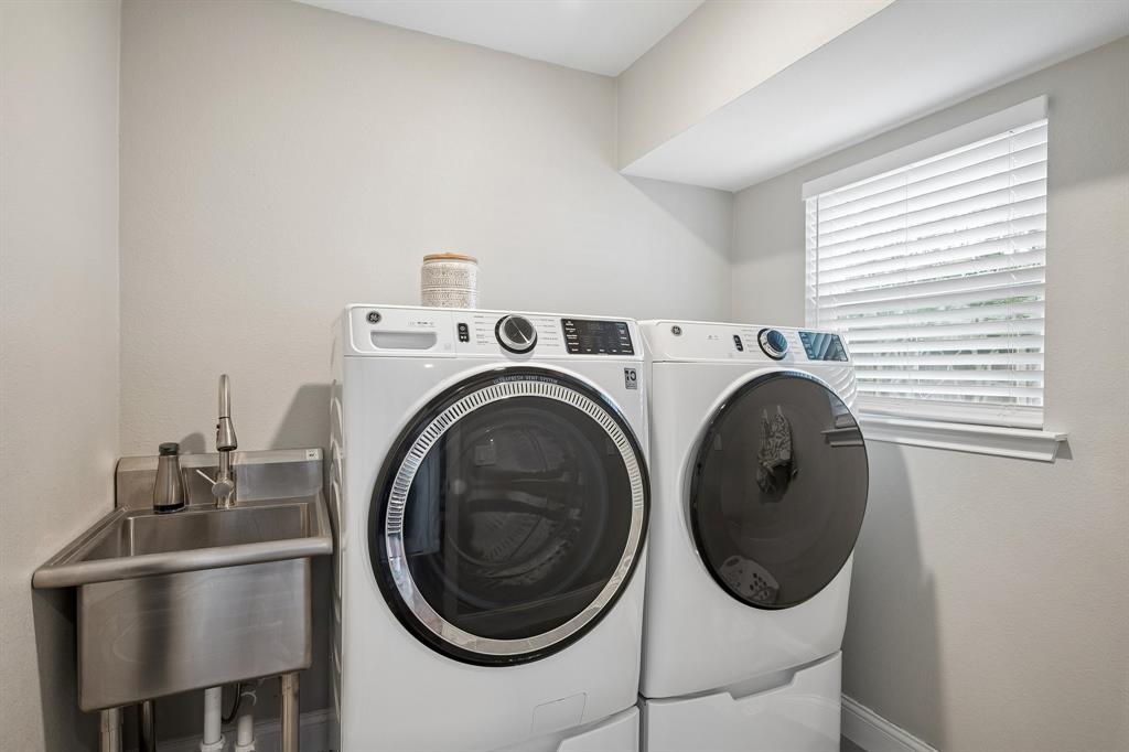 A sink accompanies this large utility room.