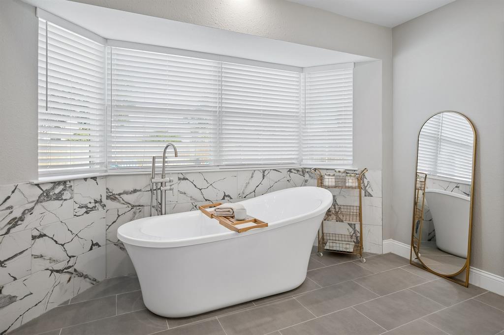 A gorgeous garden tub centers the ensuite.