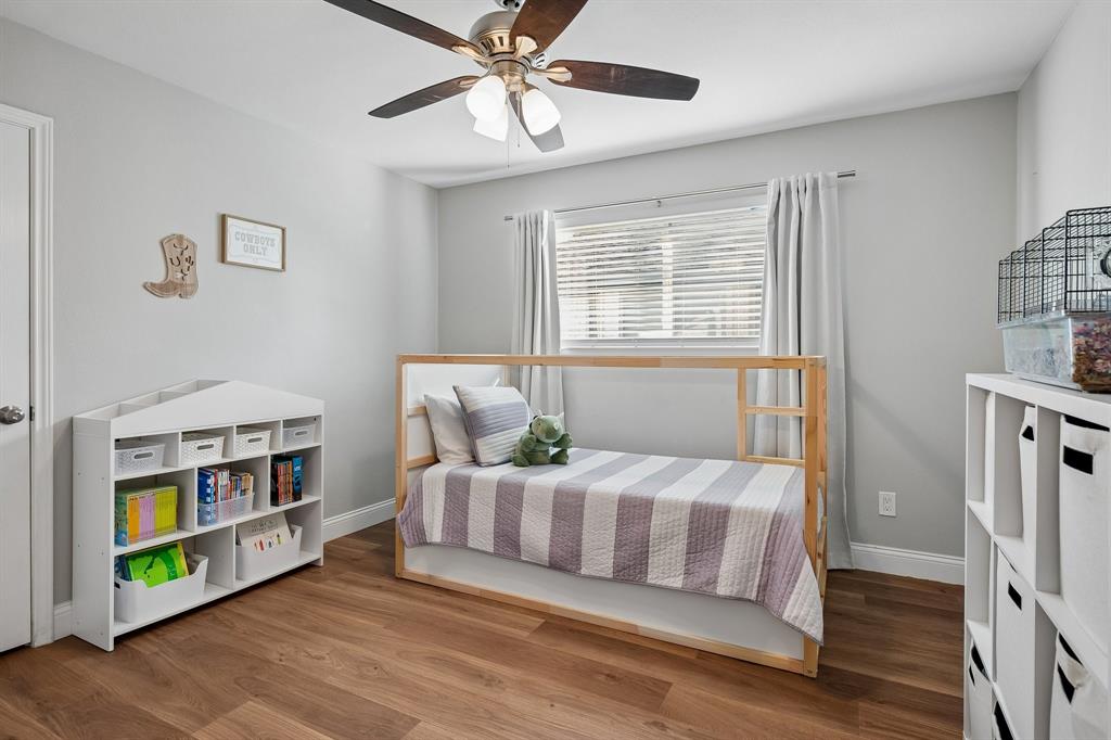 Three additional main-level bedrooms offer great flexibility.