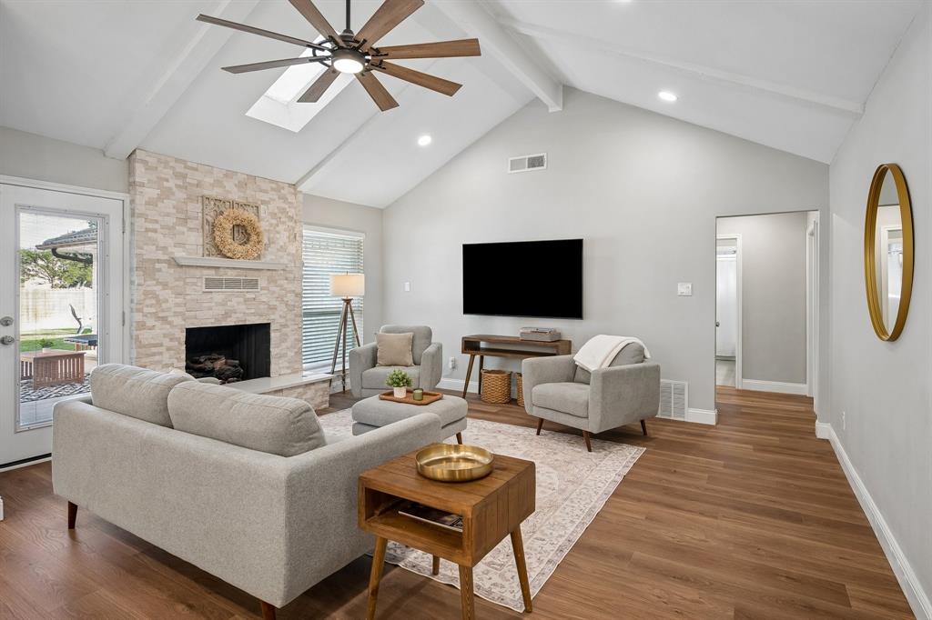 Abundant natural light pours into the main living space equipped with a skylight and vaulted ceilings. Abundant natural light pours into the main living space equipped with a skylight and vaulted ceilings.