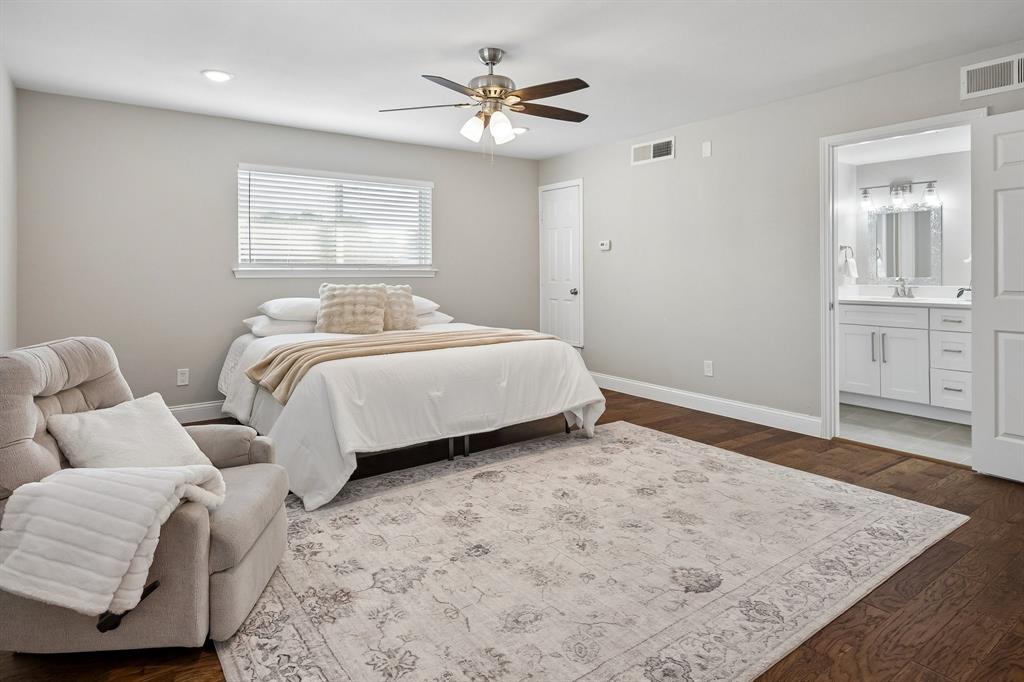 Ideal for multigenerational living, a second primary suite upstairs includes a walk-in closet and ensuite bathroom.