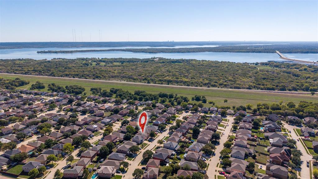 Aerial perspective showcasing proximity to an expansive reservoir and surrounding undeveloped woodland