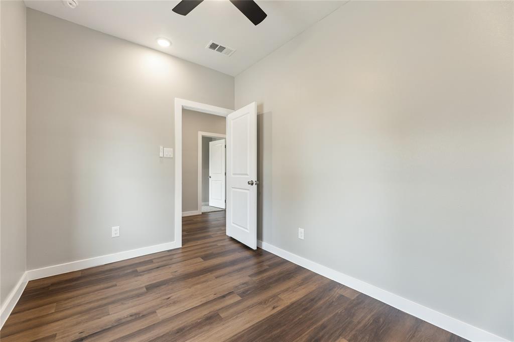Neutral-toned walls, wood-finish flooring, recessed lighting, ceiling fan, and multi-panel interior doors