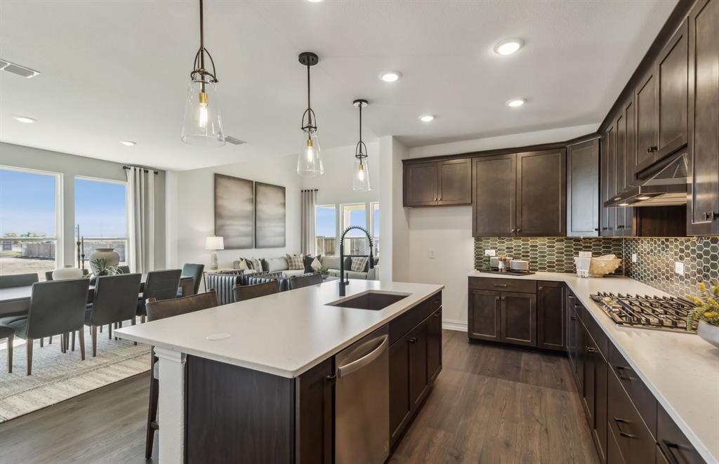 *Model Representation - Large island gathering room and dining areas overlooking