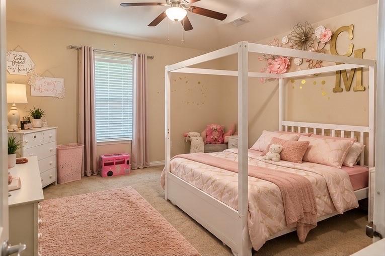 Bedroom featuring carpeted flooring, neutral wall paint, and a ceiling-mounted light fixture with integrated fan