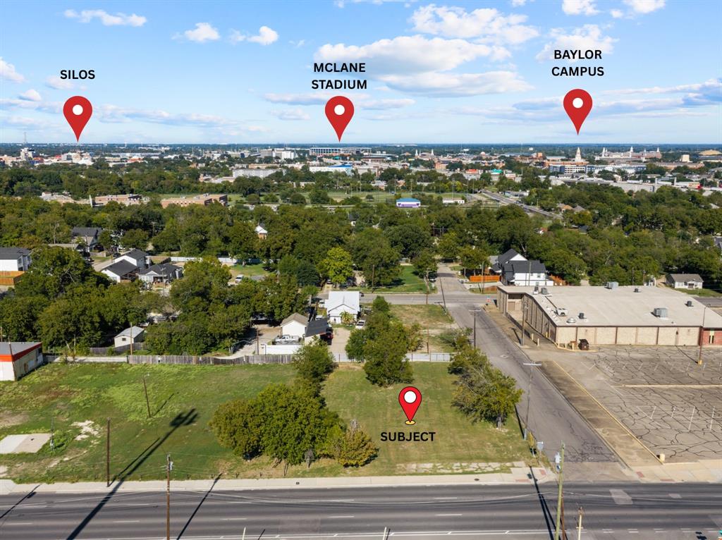Vacant land parcel featuring mature trees and street frontage with proximity to regional landmarks and institutional facilities Vacant land parcel featuring mature trees and street frontage with proximity to regional landmarks and institutional facilities