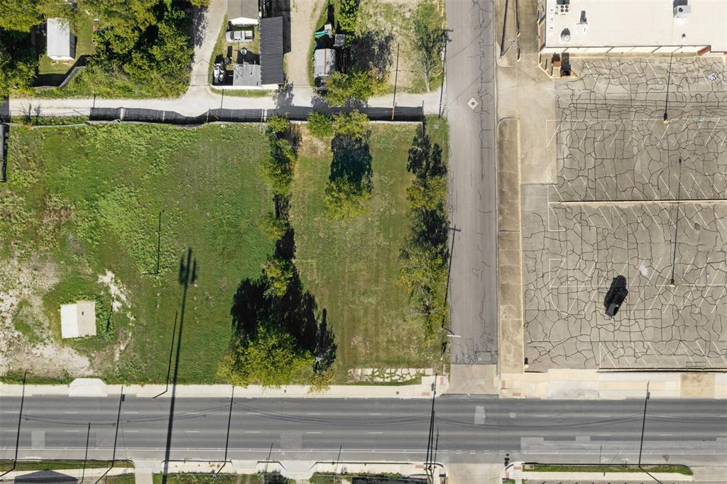 Cleared lot featuring mature trees, direct street access, and corner positioning