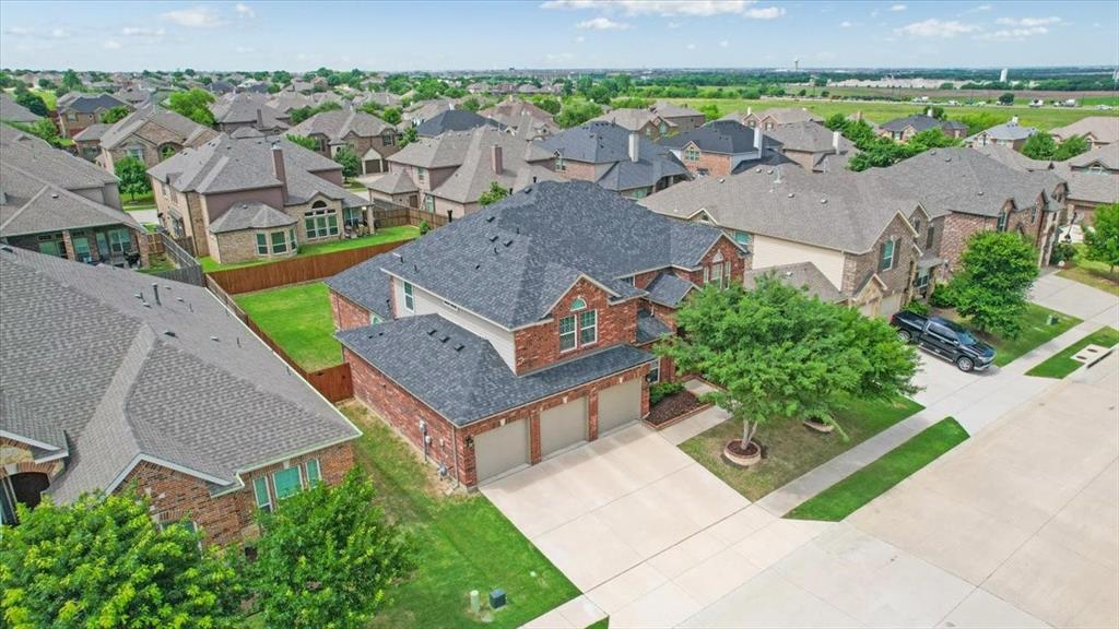 Brick veneer exterior with a two-story design and a three-car garage