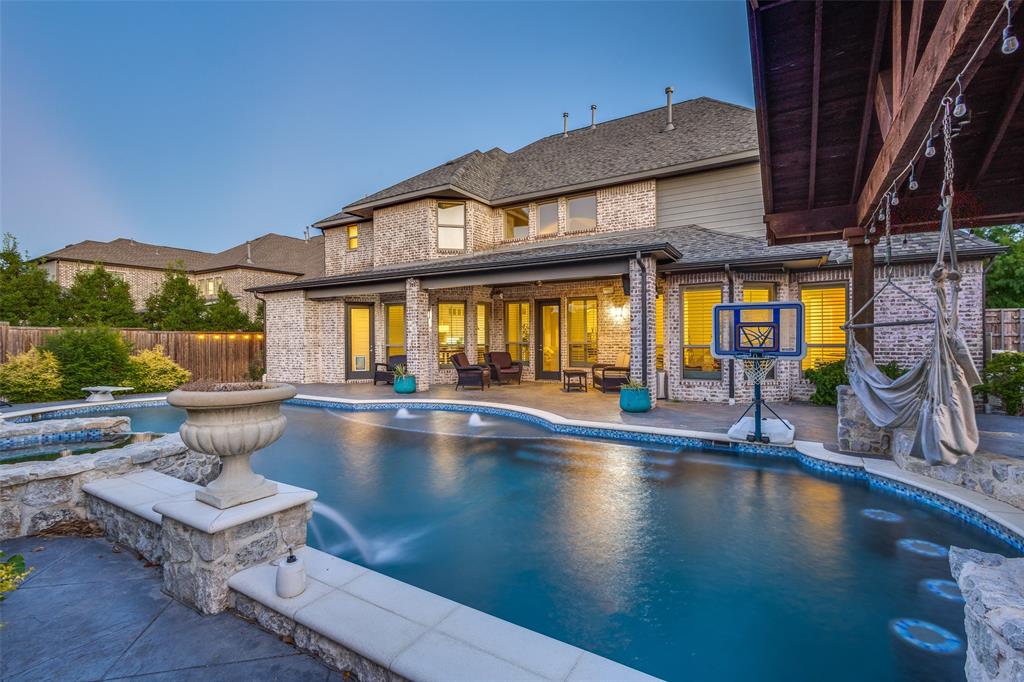 View of swimming pool with a fenced backyard, a patio area, and a hot tub View of swimming pool with a fenced backyard, a patio area, and a hot tub