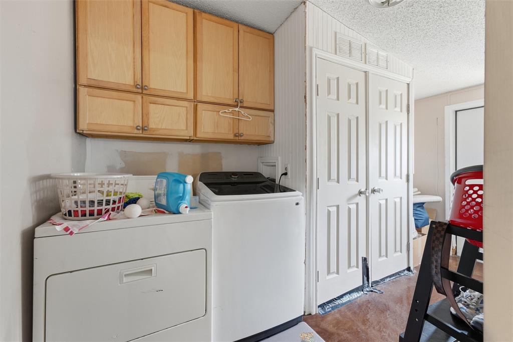 Natural wood-finish cabinetry, white double-panel doors, and vertical beadboard wall paneling Natural wood-finish cabinetry, white double-panel doors, and vertical beadboard wall paneling