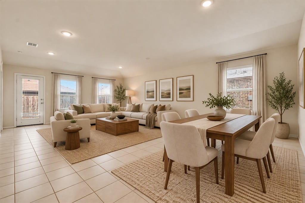 Virtually Staged Neutral-toned ceramic tile flooring, recessed ceiling lighting, and multiple windows with custom drapery hardware