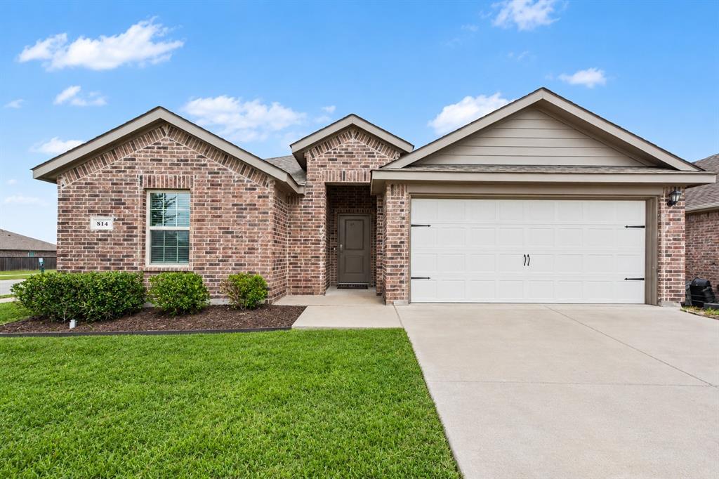Single-story brick exterior featuring a recessed entryway, dual-gable roofline, two-car garage, and concrete driveway Single-story brick exterior featuring a recessed entryway, dual-gable roofline, two-car garage, and concrete driveway