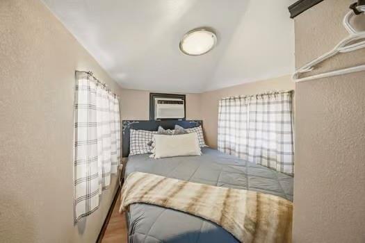 TV to watch in double bed on opposite wall