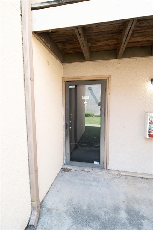 View of exterior entry featuring stucco siding View of exterior entry featuring stucco siding