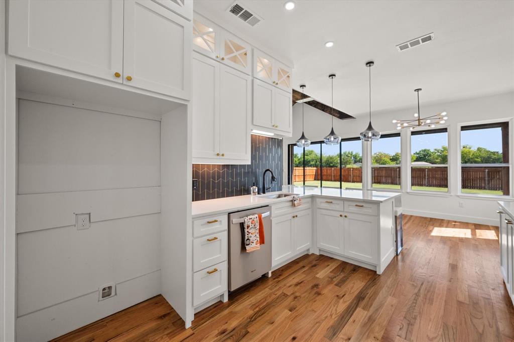 Kitchen features Whirlpool appliances-dishwasher, pendant lighting and under counter lighting