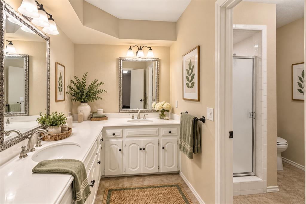 Two vanities in this lovely primary bath, with separate shower and tub - virtual staging