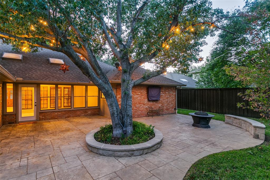 Charming view of Back of Home with Abundance of Windows