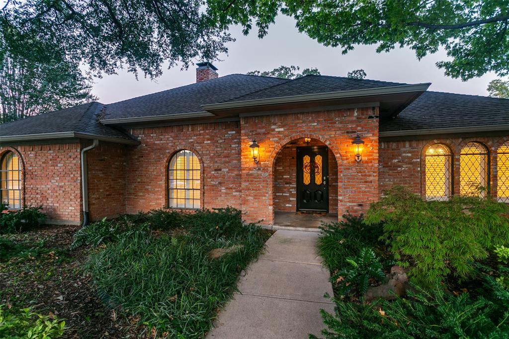 Filled with beautiful landscaping along the lead walk to front door