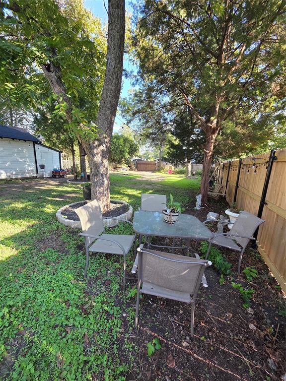 Great shaded sitting area in backyard