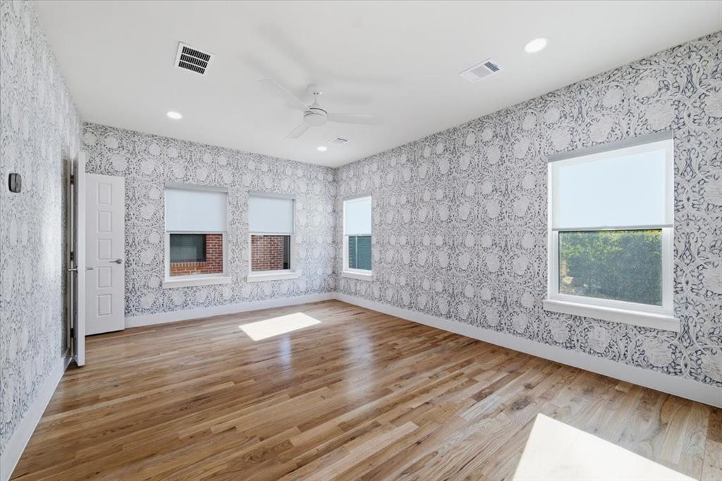 Walk in closet, dramatic custom wall paper, private bathroom on second level