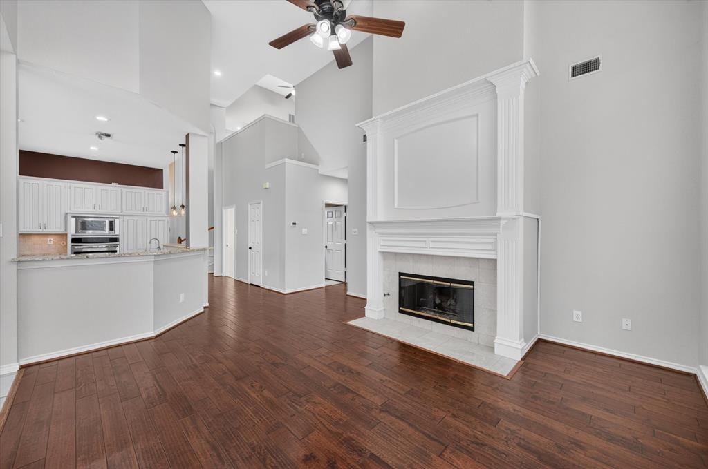Living room adjacent from breakfast area and kitchen