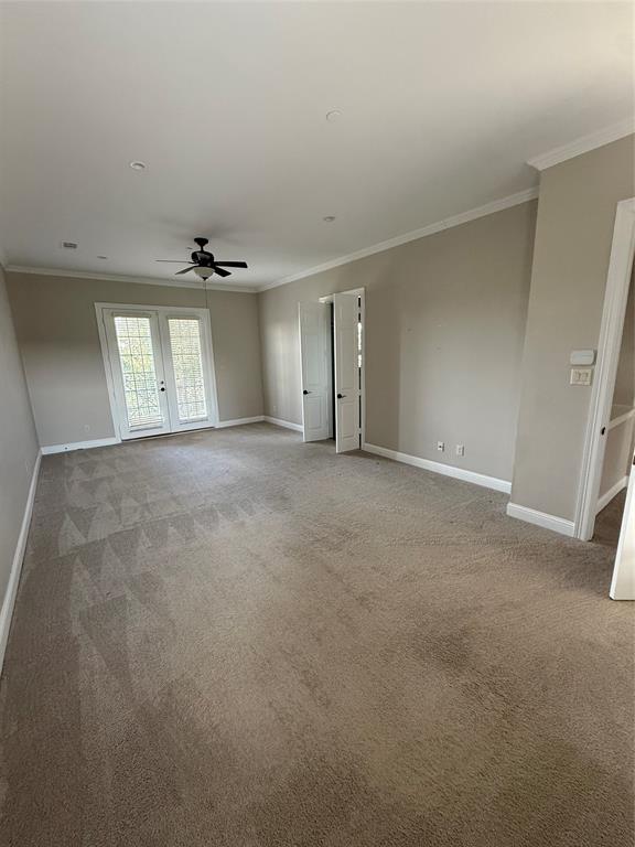 Spacious room featuring carpeting, French doors with glass panes, recessed lighting, and a ceiling fan