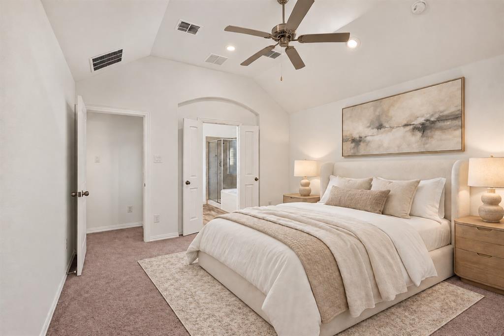 Vaulted ceilings featuring a central overhead fan, recessed lighting, and dual-door entries