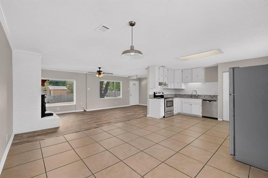 Bright dining area showcasing tile floors, ready for new furnishings.