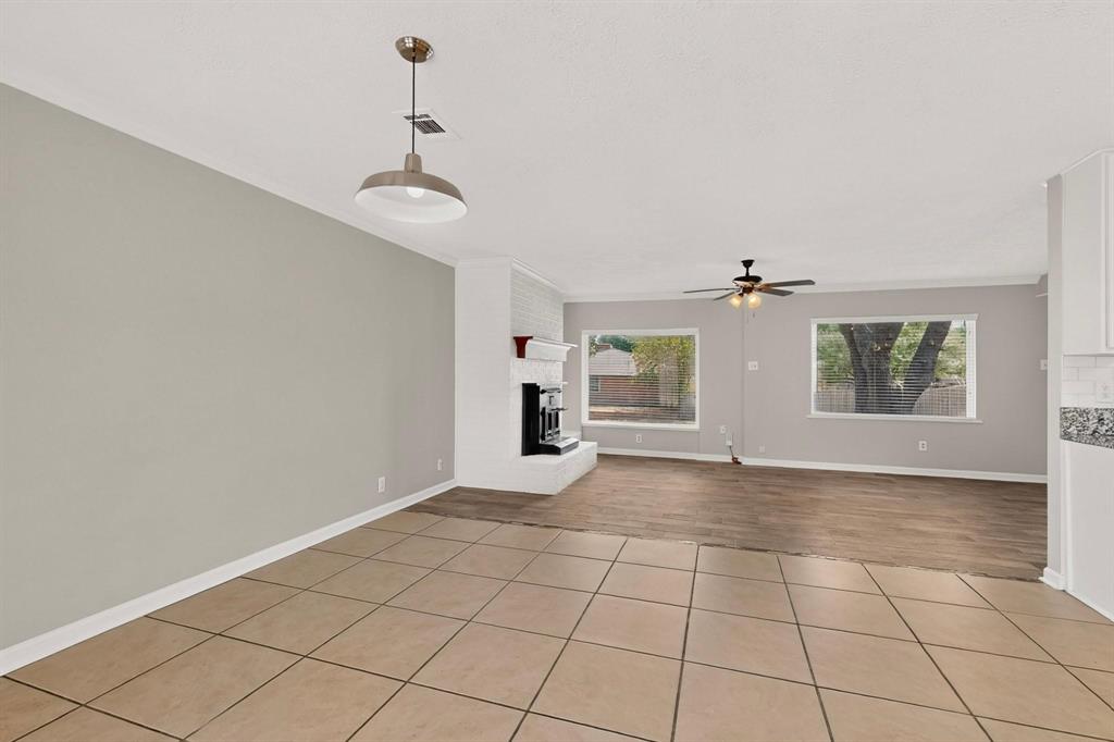 Open dining area with clean tile flooring, perfect for a fresh design.