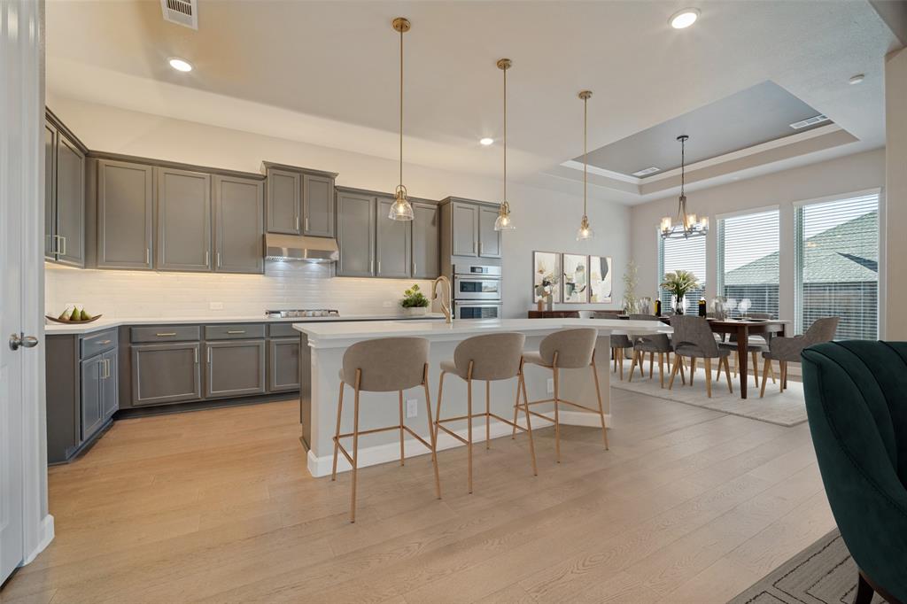 You'll love cooking in this stunning neutral clean kitchen bathed in natural light & open to the living and dining room; Virtually staged