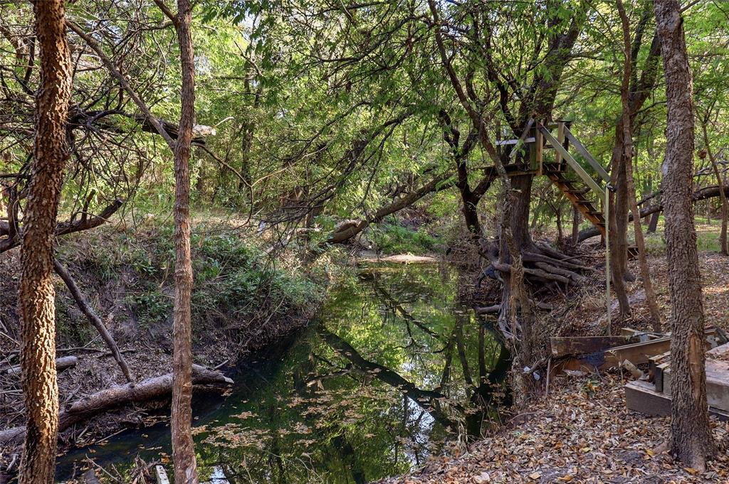 Peaceful creek flows through the rear of the property.