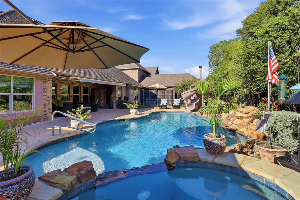 View from spa across pool to covered patio