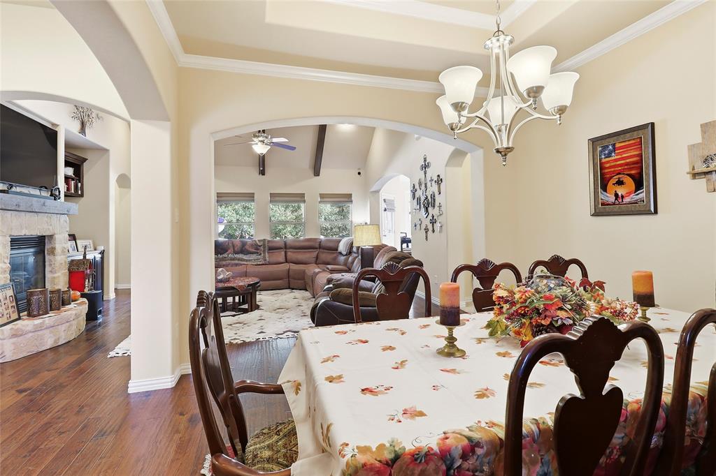 Formal Dinng features elevated ceiling, crown molding and is open to Living area.