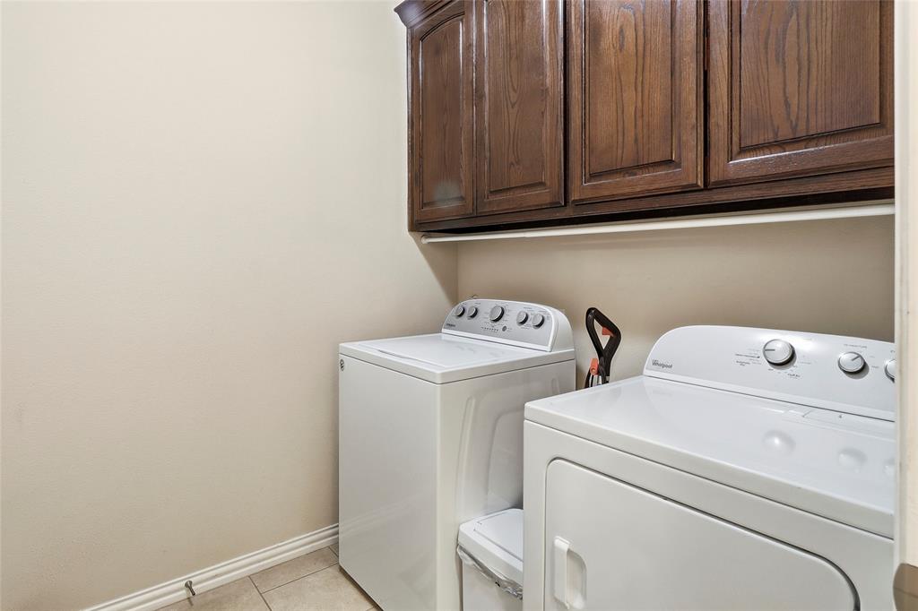 Spacious utility room with built-in cabinetry.