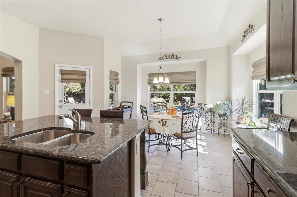 Expansive Breakfast area with a view of backyard and pool