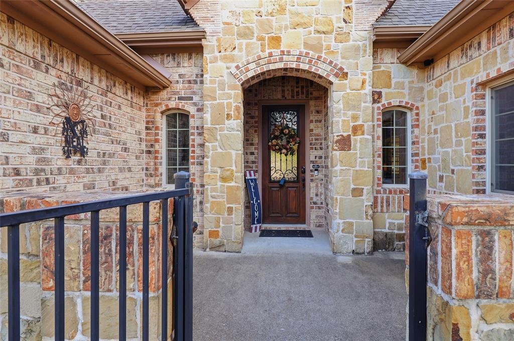 Covered arched front entry way.