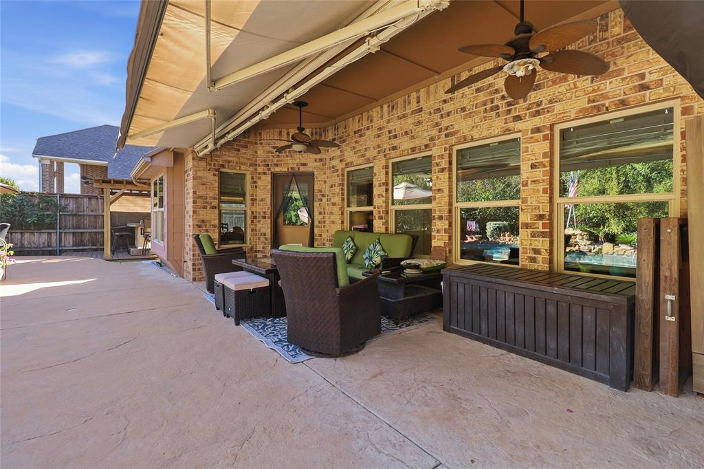 Massive covered patio with electric awning for extended shade area