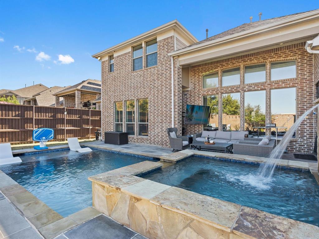 View of swimming pool featuring a patio, outdoor lounge area, and a pool with connected hot tub