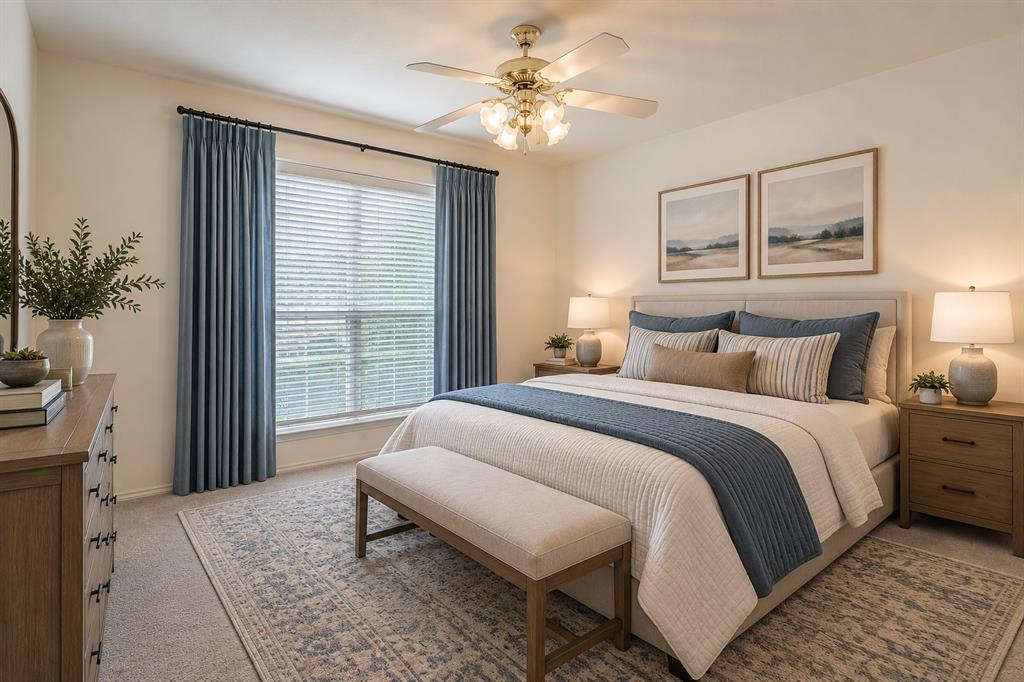 Neutral interior space featuring carpeted flooring, a multi-light ceiling fan, and a window with horizontal blinds and drapery hardware