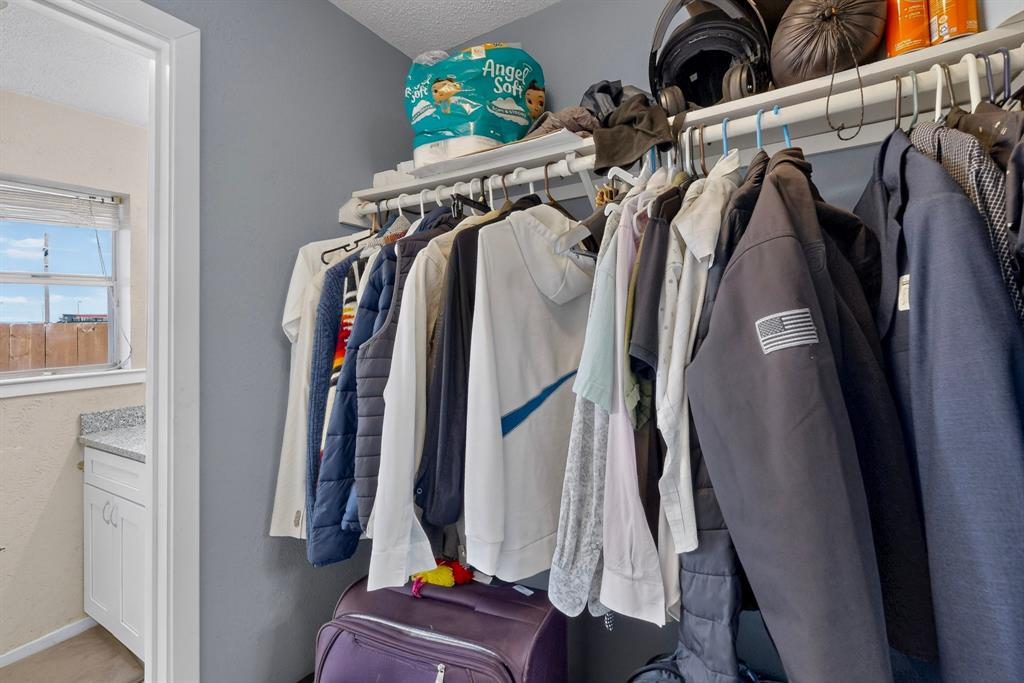 Reach-in storage featuring a white metal rack system with integrated shelving