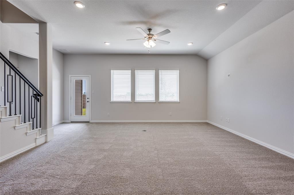 Unfurnished living room with stairs, carpet flooring, recessed lighting, and ceiling fan